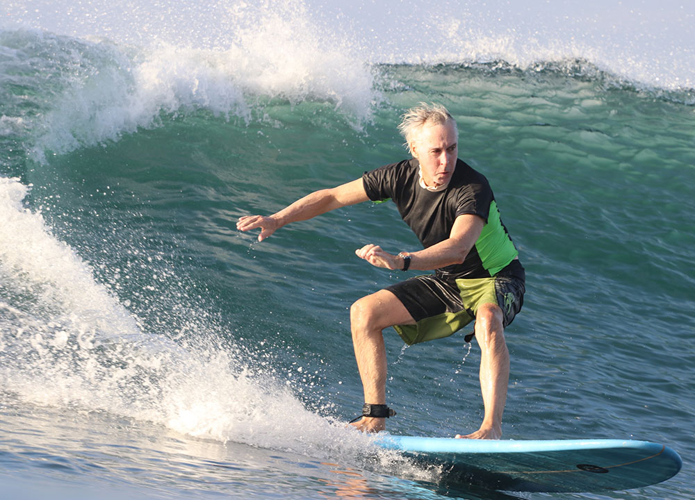 mike downey rides a wave